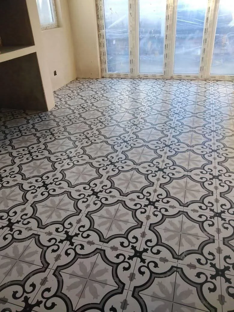 Retail floor retile for a high-traffic unit with durable tile and grout finish